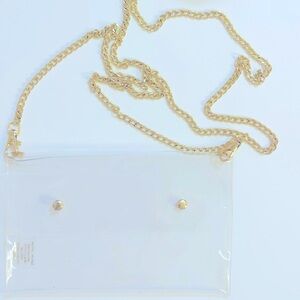 Clear envelope style two gold snap button gold link chain.